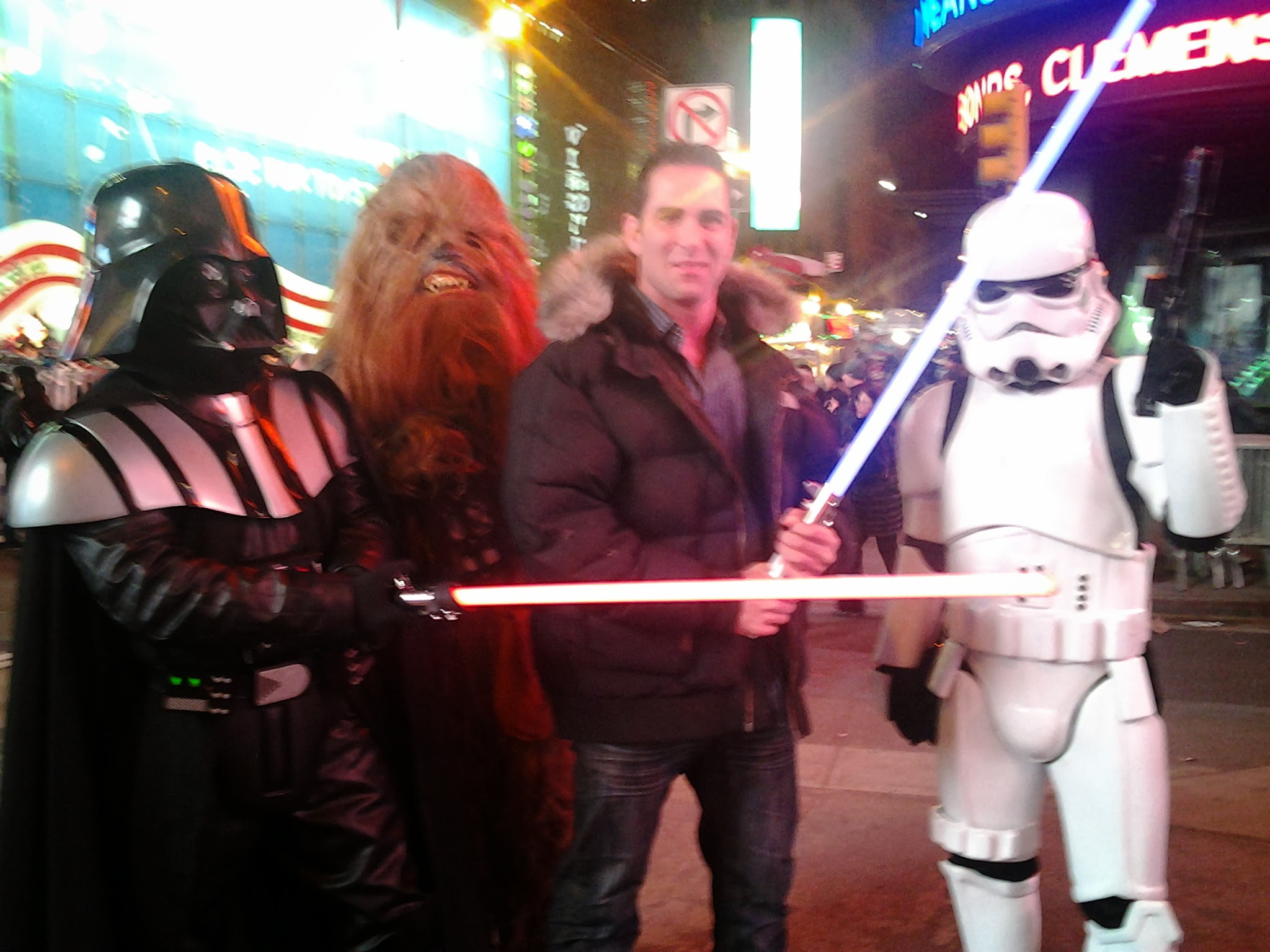 Israel Joffe on a New York street posing with costumed Star Wars characters
